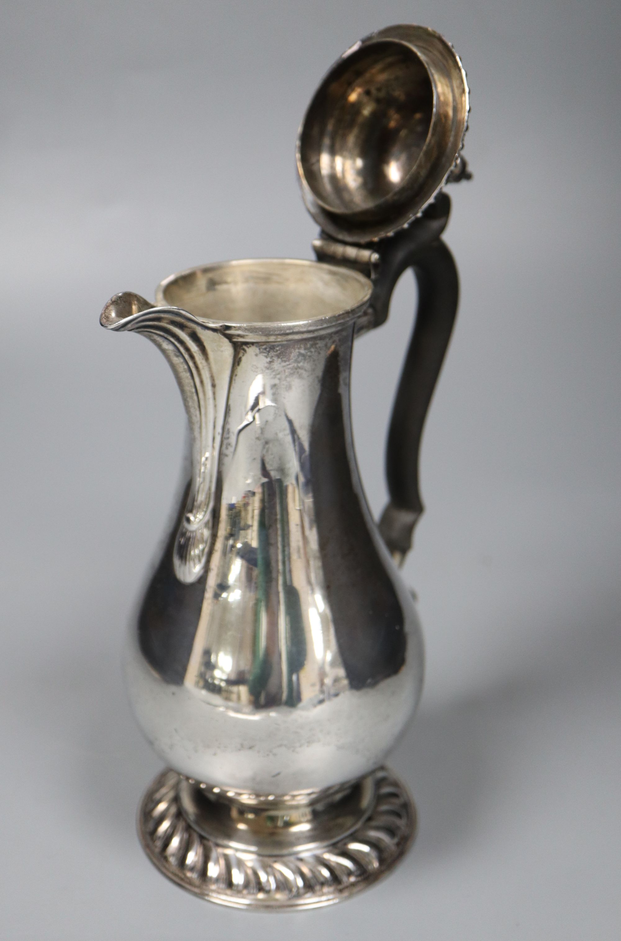 A George V silver baluster hot water pot, with ebonised handle, Goldsmiths & Silversmiths Co Ltd, London, 1927